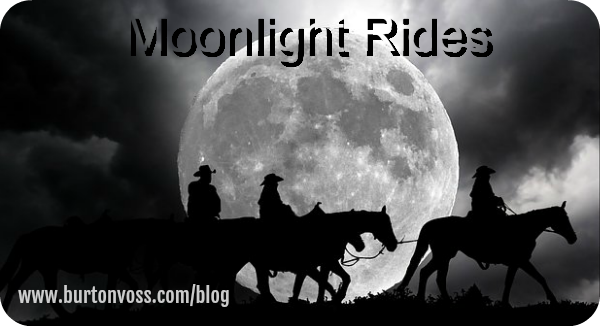 Riders silhouetted against the full moon.
